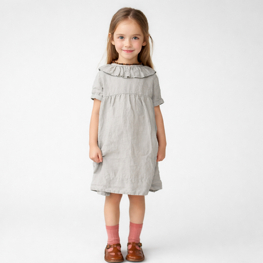 Toddler girl wearing cotton linen ruffle neck puff sleeve A-line summer dress in light coffee color.