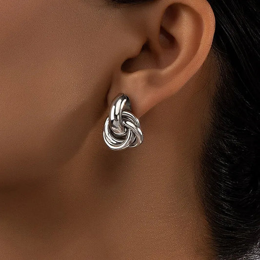 Woman wearing knot hoop earrings – elegant daily wear accessory