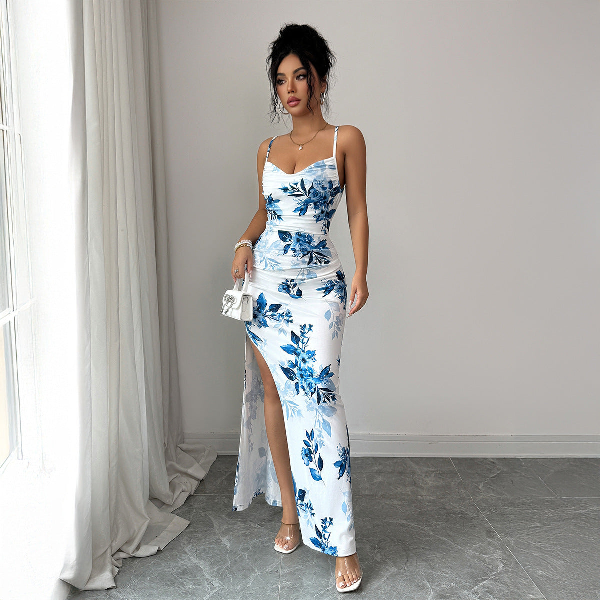 Sleeveless white and blue floral evening dress full length