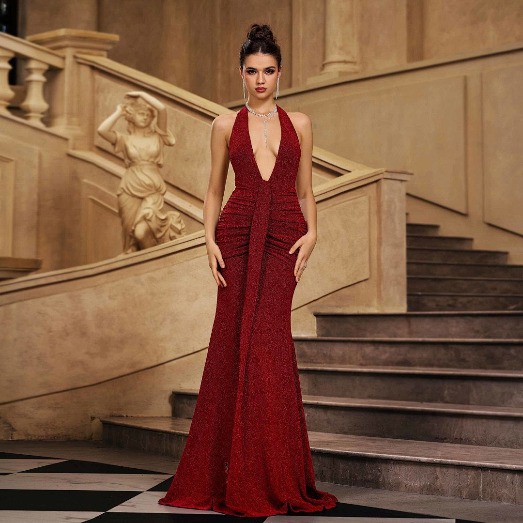 Elegant red glitter halter mermaid evening gown with plunging V-neckline and ruched waist detail