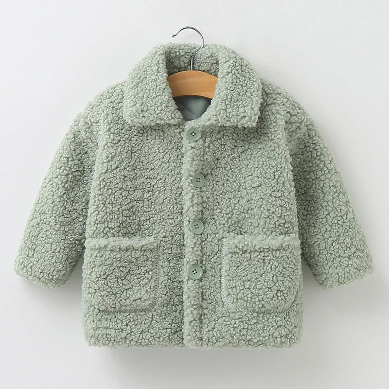 Soft lamb’s wool texture on children’s warm winter coat
