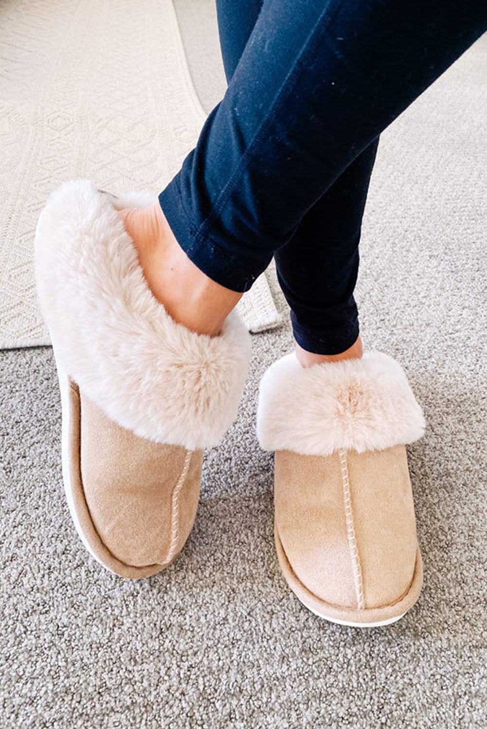 Woman wearing khaki slippers at home – warm and stylish indoor comfort.