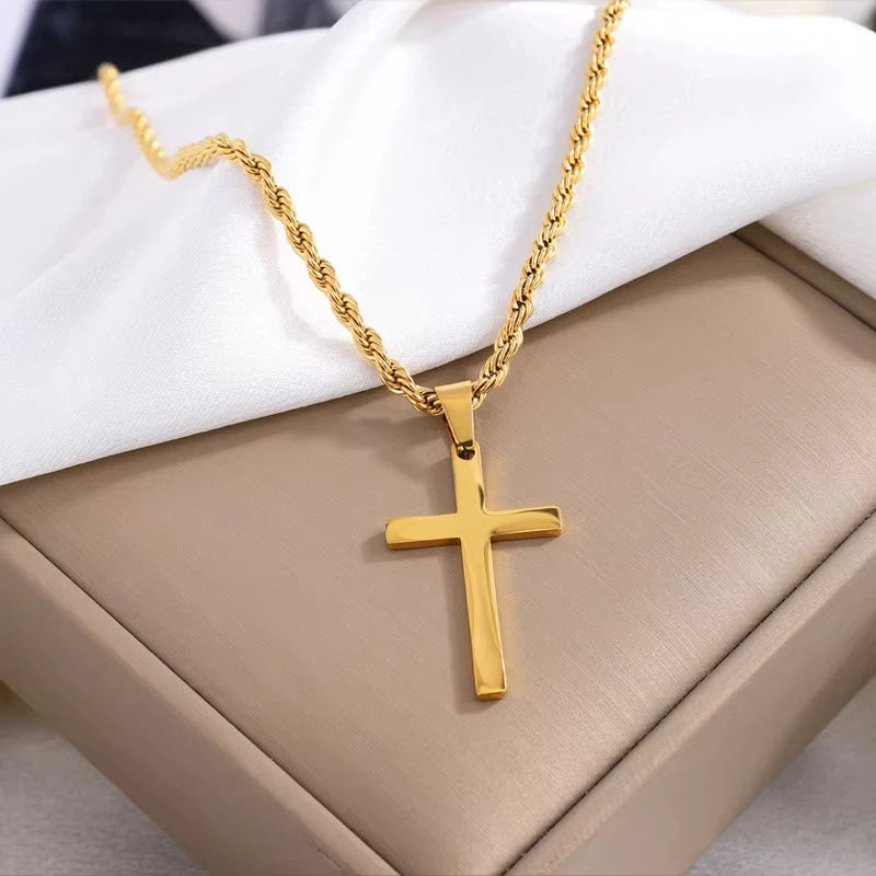 Polished gold stainless steel cross pendant on fine chain