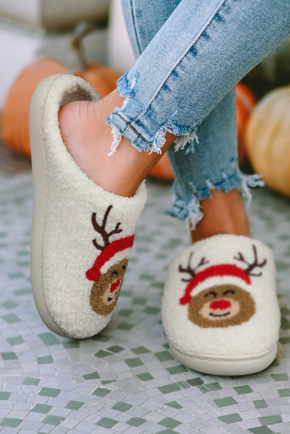 Woman wearing white Christmas deer slippers – cozy and festive winter homewear