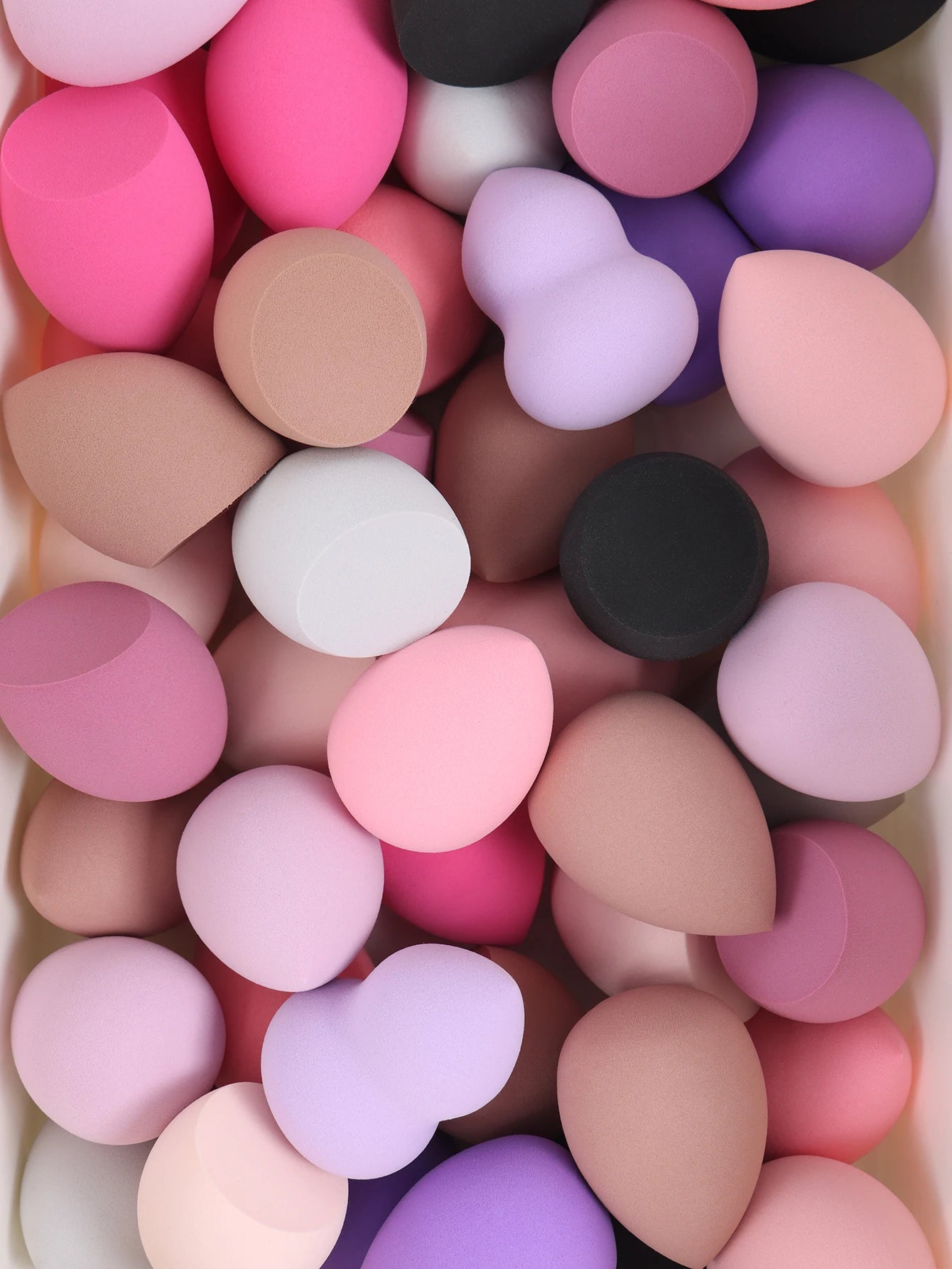 Assorted medium-size beauty sponges in random colors and shapes – bulk makeup blending set.