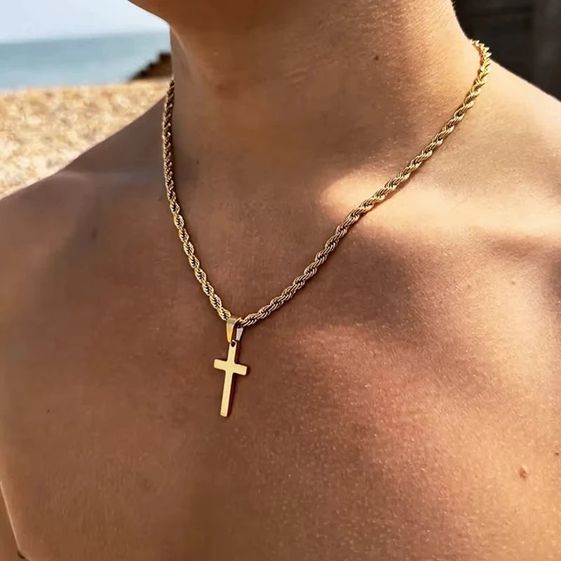 Unisex gold cross necklace worn with casual outfit – modern minimalist jewelry.
