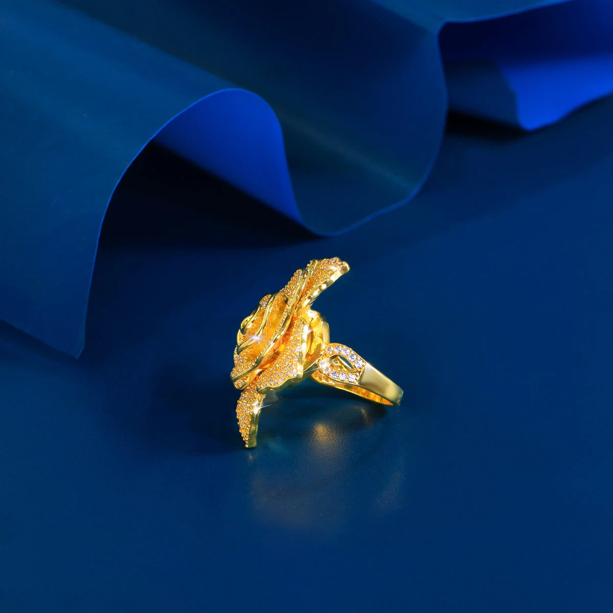 Detailed view of large flower-shaped cubic zirconia ring in gold setting