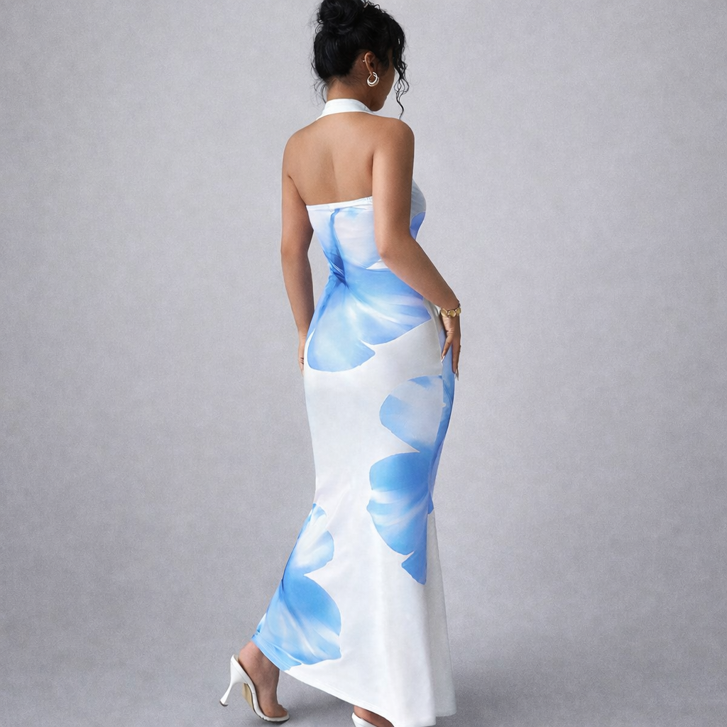 Back view of blue floral halterneck bodycon maxi dress with floor-length slim silhouette.