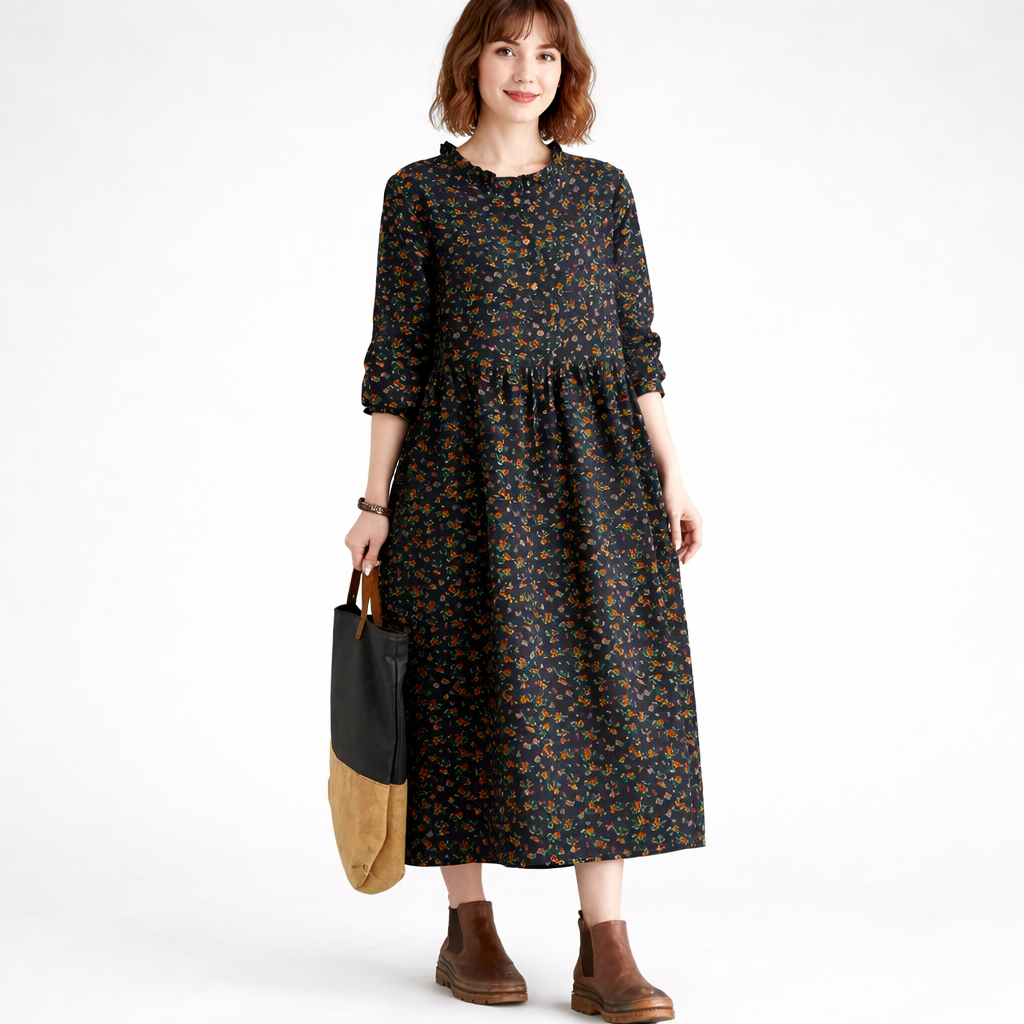 Woman wearing a floral dress holding a black and brown bag on a white background
