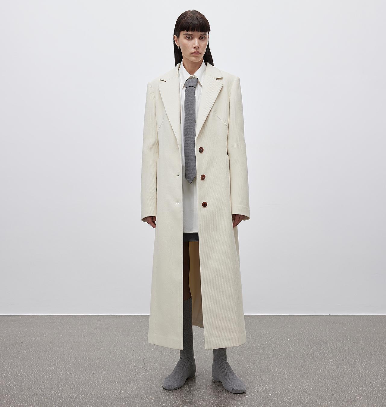 Rich vertical corduroy stripes showing soft, raised texture and detailed tailoring