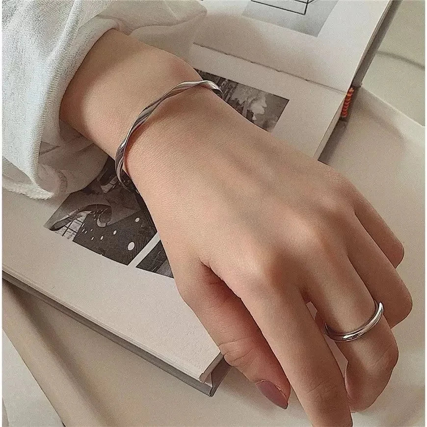 Woman wearing minimalist geometric bracelet – thoughtful modern gift for mothers
