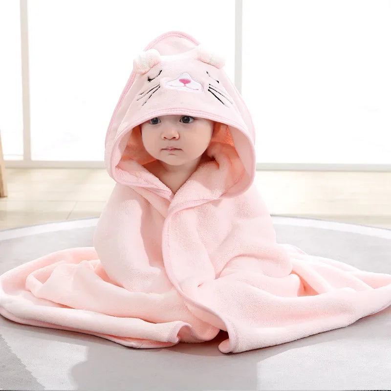Baby wrapped in hooded bath towel – cozy coral fleece blanket for 0–2 years old