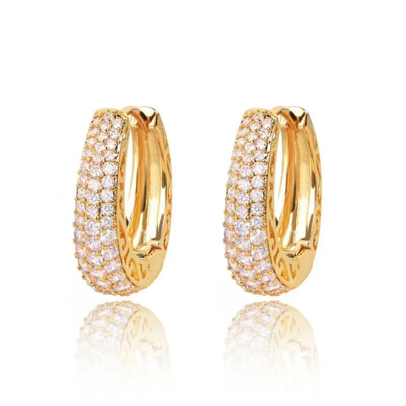 Huitan hollow gold hoop earrings with CZ stones – luxury statement jewelry for women.